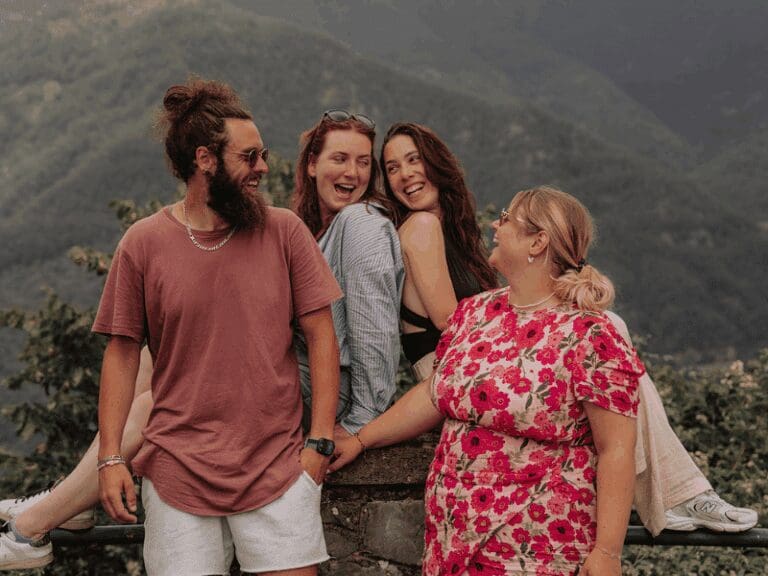 family laughing together for a picture in Tuscany
