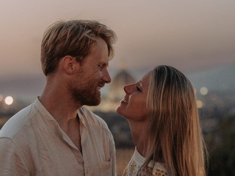 couple staring into each other's eyes romantic moment with view