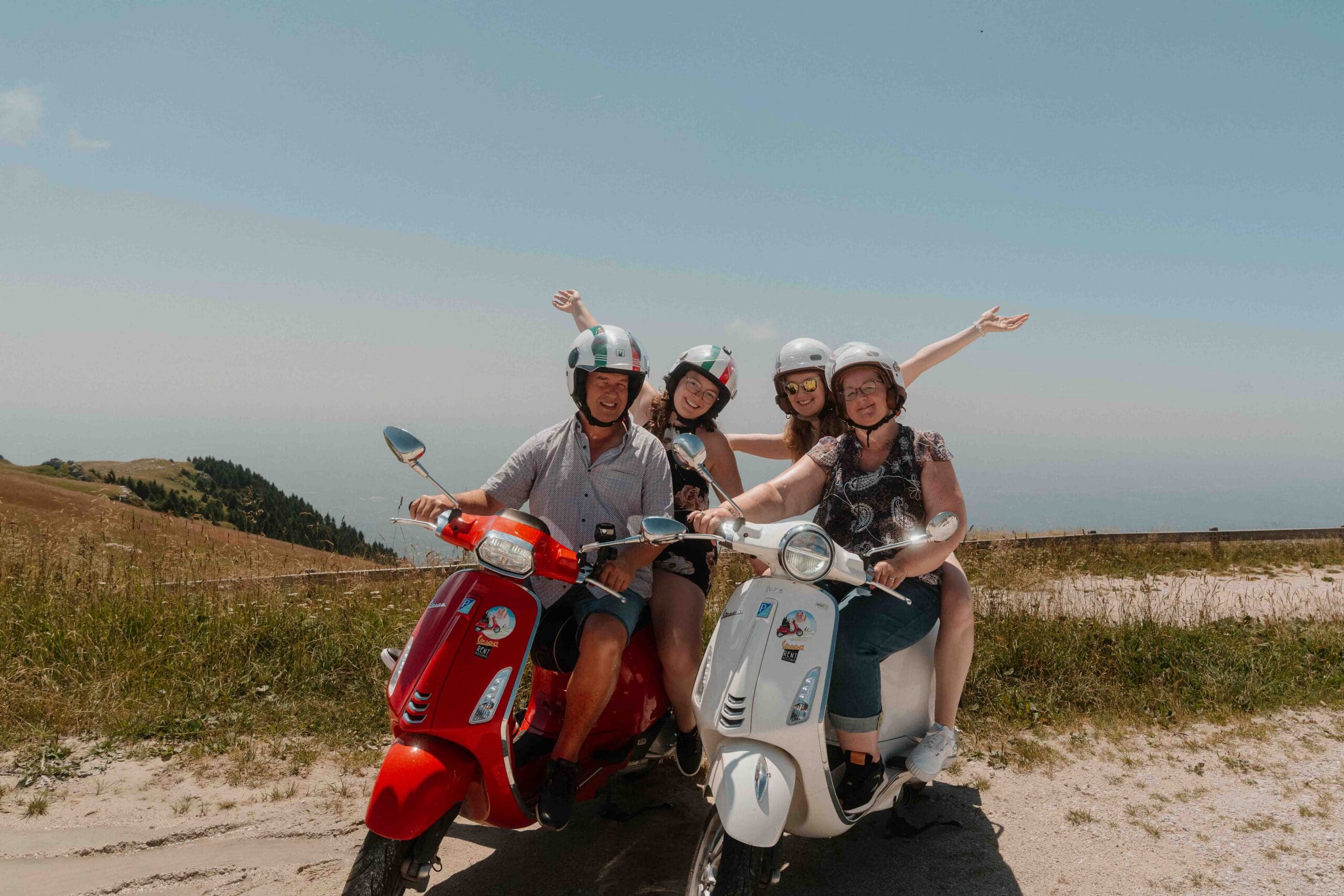 group of happy people doing the vespa trip dolomiti